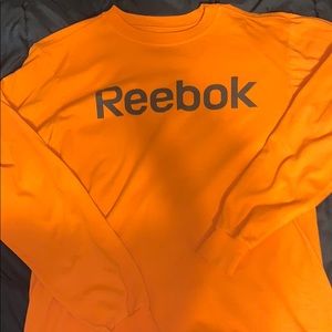 Orange long sleeve Reebok shirt